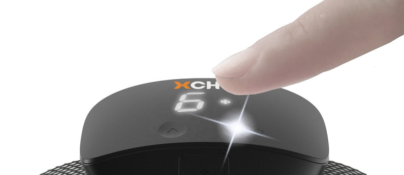 person pushing the button on the XCHO black bark collar